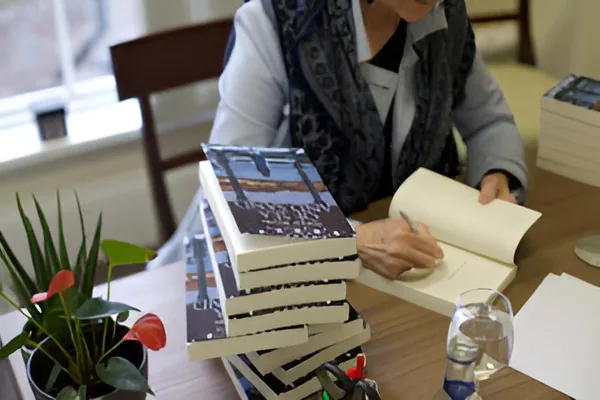 Denyse Woods signing copies of her book